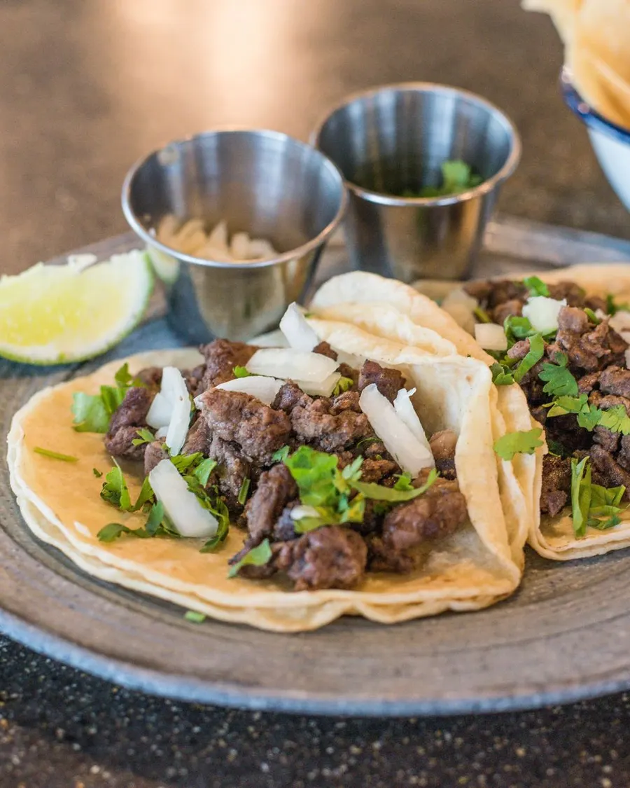 Steak tacos with onion and cilantro